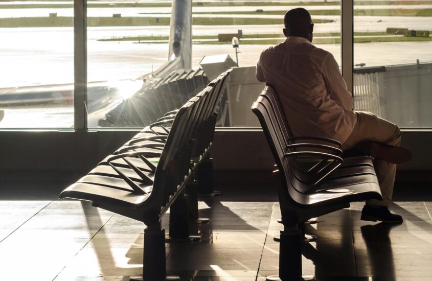 A man sitting at the airport.